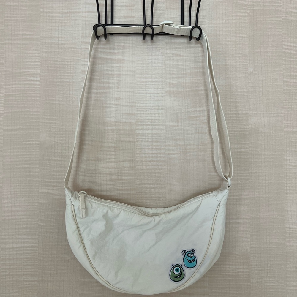 Cream Crossbody Bag with Pixar’s Monsters Inc. Patches